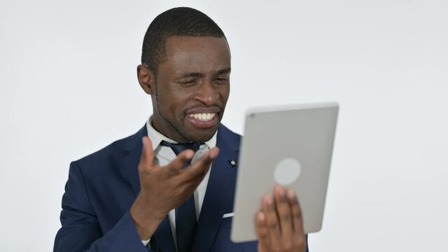 Failure on Tablet by African Businessman, White Background