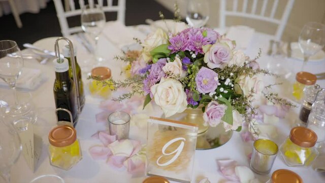 table nine flowers and candles and settup