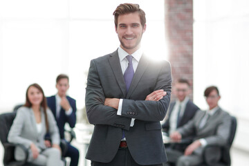 Successful businessman at the office leading a group