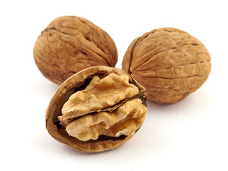 Walnuts and shells lie on a white background.Isolate
