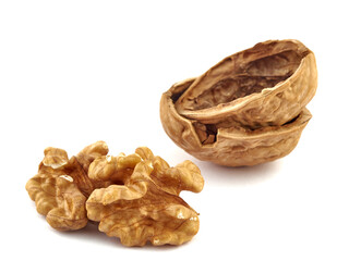 Walnuts and shells lie on a white background.Isolate