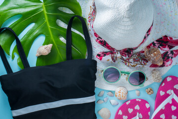 summer accessories like swimwear hat and sunglasses with seashells