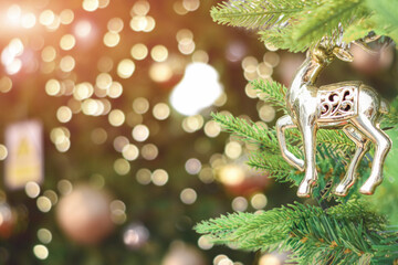 Closeup of decorated Christmas tree on blurred background.