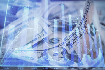 Double exposure of forex graph drawing over us dollars bill background. Concept of financial markets.