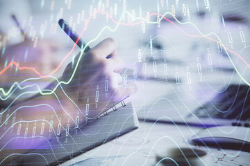 Double exposure of forex graph drawing over people taking notes background. Concept of financial analysis