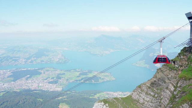 Aerial cableway with scenic lake in background, Pilatus, Switzerland
