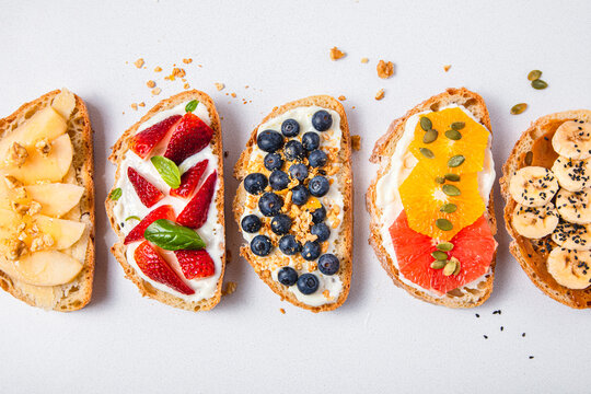 Studio shot of five slices of bread with fresh fruits