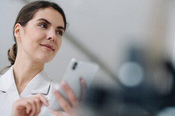 Businesswoman using mobile phone at office