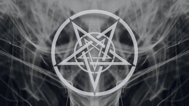 Inverted pentagram in the air. Magic symbol. Smoke moving on a black background
