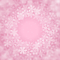 Christmas background of snowflakes of different shape, blur and transparency, arranged in a circle, on pink background