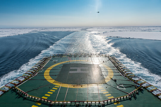 Helipad of ice-breaker 50 Years of Victory cleaving through ice of Arctic Ocean