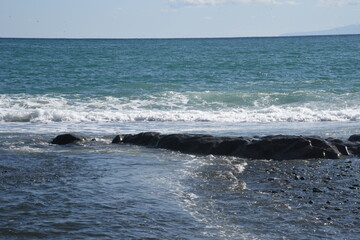 Fototapeta premium White waves on the autumn beach.