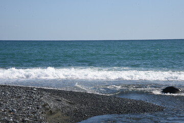 White waves on the autumn beach.