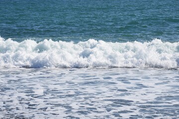 White waves on the autumn beach.