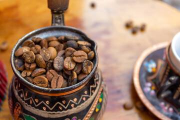 Coffee beans in a coffee pot. Turkish coffee concept