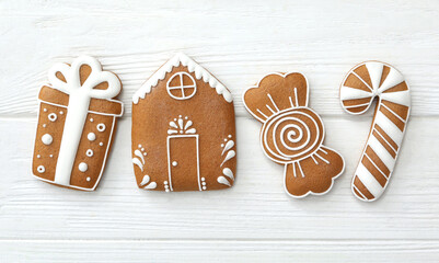 Different delicious Christmas cookies on white wooden table, flat lay