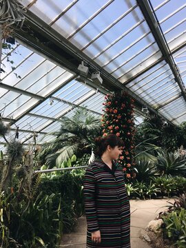 A woman in a greenhouse