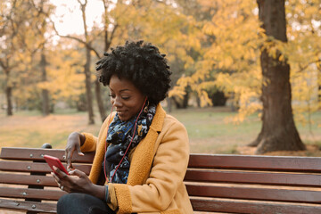 Afro Woman Listening Music With Earphones