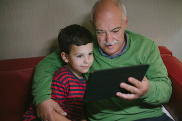 Granpa and grandchild making a video call