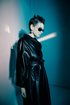 Stylish woman in futuristic outfit