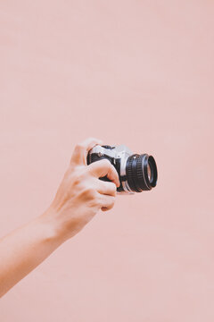 Female hand holding a camera