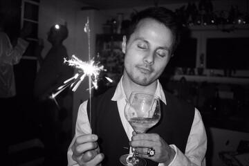 A beautiful man happy smiles on a new year party