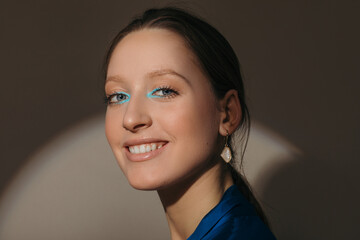 Cheerful woman with stylish makeup