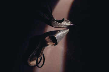 Fancy shoes in dark room