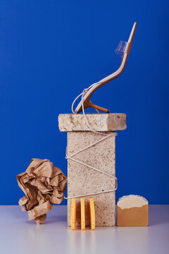 Sandals with pumice near bricks with paper