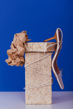 Shoe and paper attached to bricks