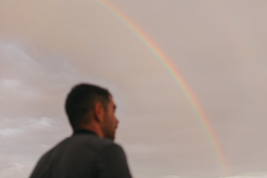 Man watching a rainbow