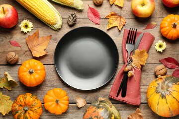 Flat lay composition with tableware, autumn fruits and vegetables on wooden background....