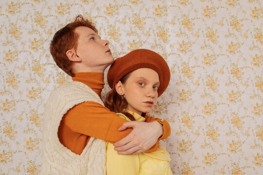 Young ginger models in knitted clothes