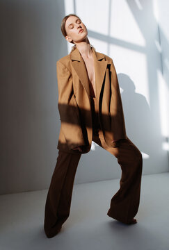 Sensual Woman In Trendy Brown Suit