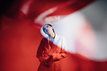 Trendy woman in white jacket