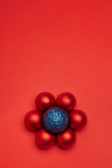 New Year's toy hovering in the air on a red background