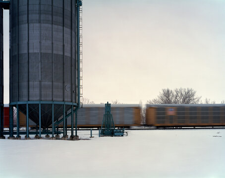 A train traveling in the winter.