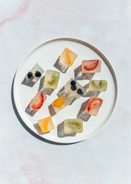 Japanese fruit jellies with fresh fruit on ceramic plate