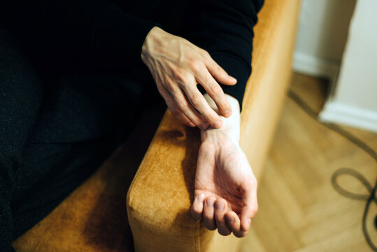 A man scratching himself