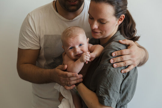 Baby in the arms of parents