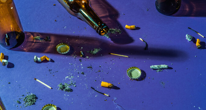 Messy and dirtyspace. Bottles and cigarette ends and ashes