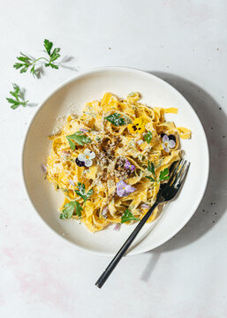 Homemade pasta with edible flowers