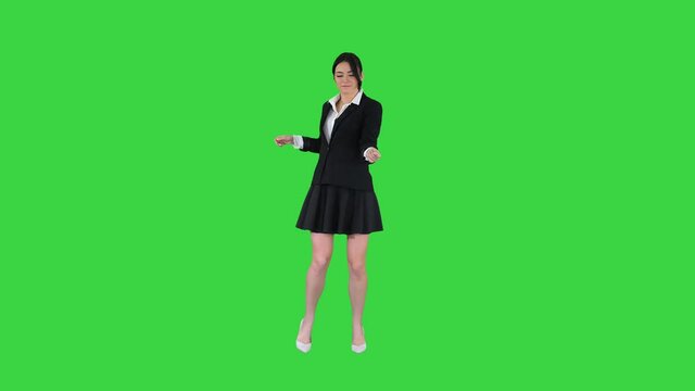 Brunette school girl dancing on a Green Screen, Chroma Key.