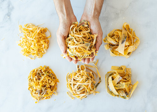 Hand holding ball of fresh made pasta