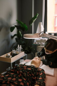 Young Woman Getting Natural Eyelash Treatment