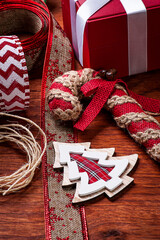 Fototapeta premium .Christmas composition on wooden background with ribbons and gifts.Top view. Copy space