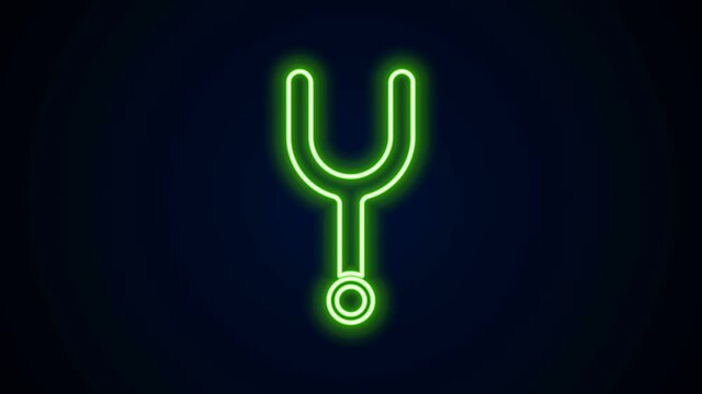 Glowing neon line Musical tuning fork for tuning musical instruments icon isolated on black background. 4K Video motion graphic animation.