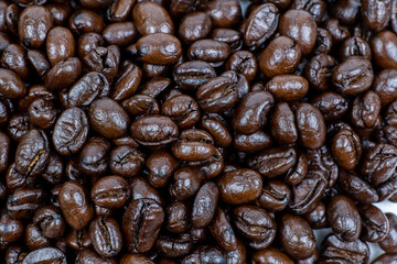 roasted dark coffee beans background, top view, high resolution mode.
