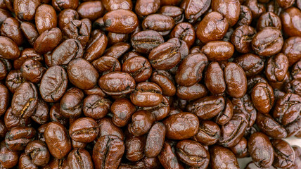 roasted medium coffee beans background, top view, high resolution mode.