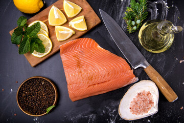 piece of red fish with sauce on the table